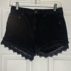 Free People lace trim black denim Now Or Never shorts - size 26